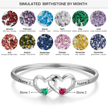 Pulsera personalizada con corazón entrelazado en color plata y dos piedras de nacimiento con nombre grabado.